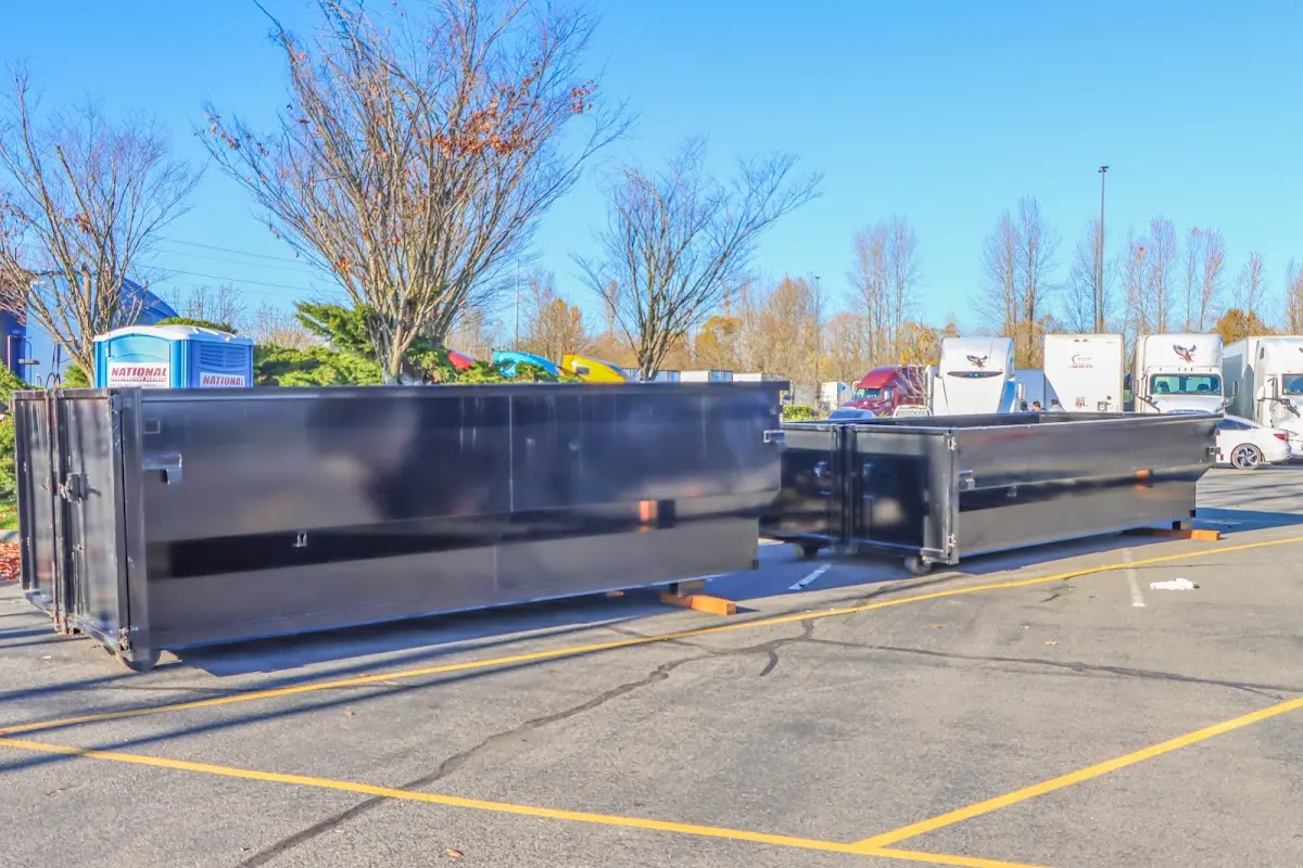 Professional dumpster rental service with roll-off container on residential driveway in Ceres